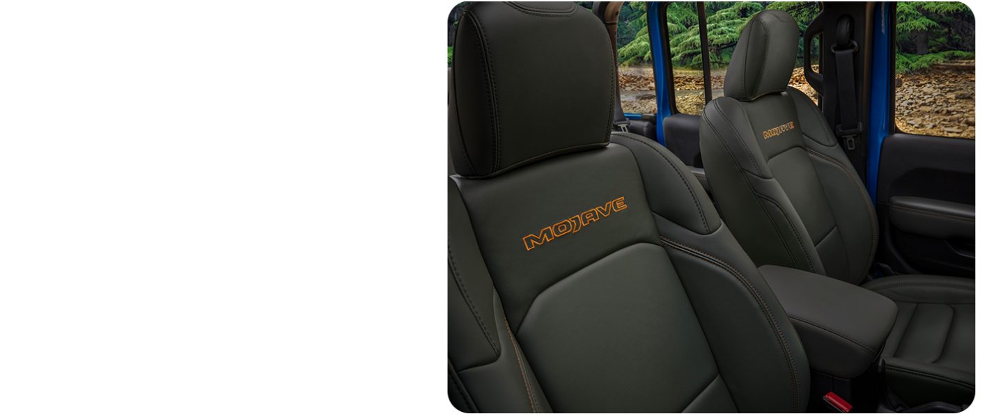 The front seats in the 2026 Jeep Gladiator Mojave X with its top removed.