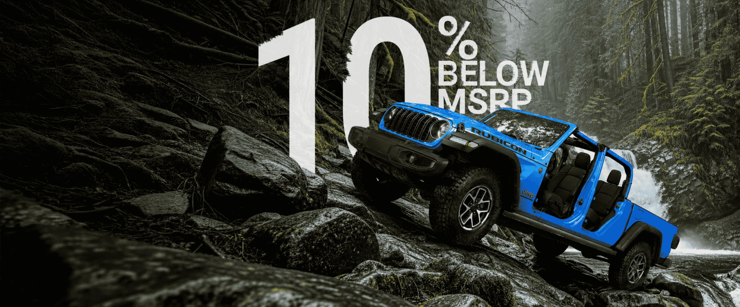 A blue 2026 Jeep Gladiator Rubicon with its doors and top removed, parked on a steep, rocky trail, just above a rapid stream with a waterfall in the background. Make this the Summer Event.